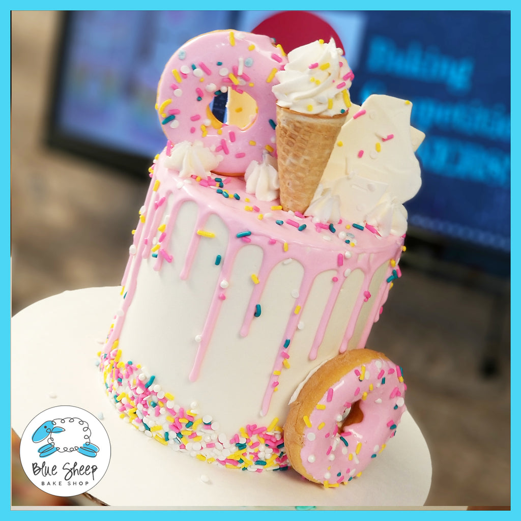 Pink and white ice cream cone confetti donut drip cake nj best cakes