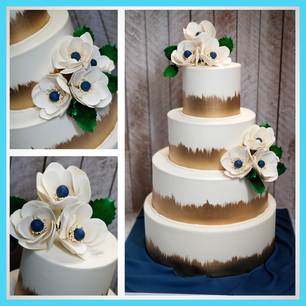 Buttercream wedding cake with sugar anemones. 