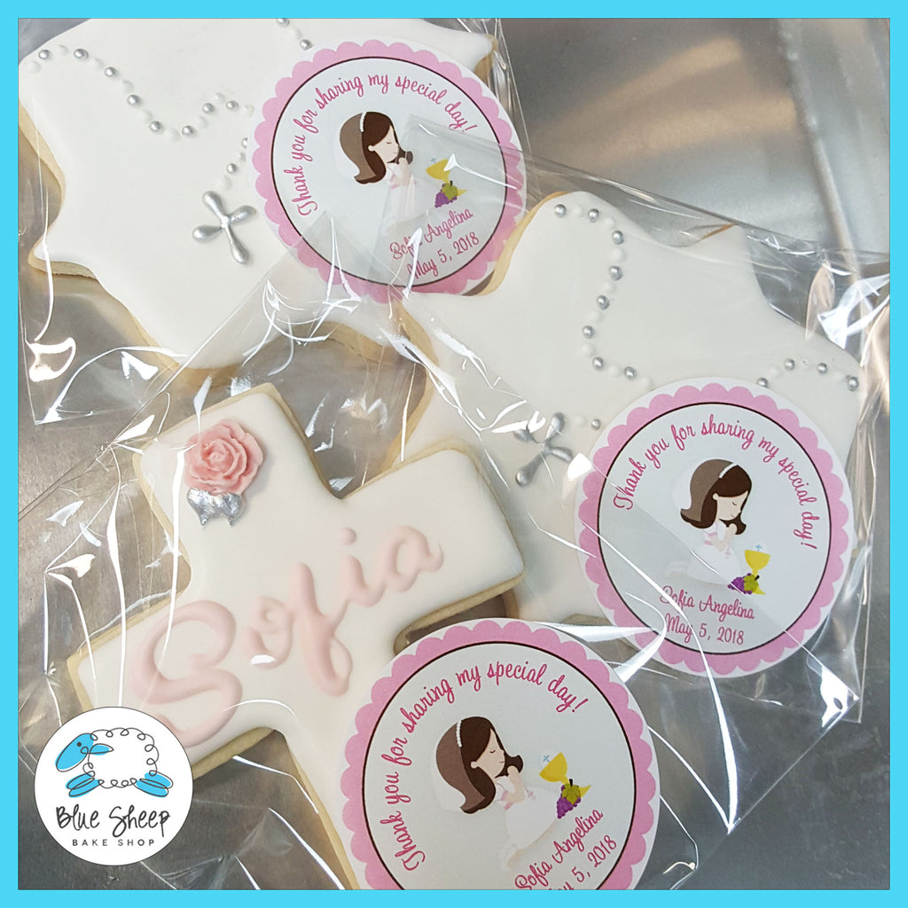 NJ sweet pink and white custom cookie favors in cross and decorative shapes, decorated with the special girl's name in cursive, and silver rosaries