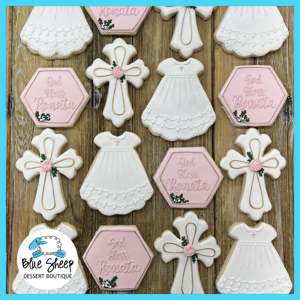 NJ customized decorated sugar cookie party favors, for a baptism or first communion. Designs feature a hexagon with hand-piped script, reading "God Bless Renata", a baptism dress, and a cross with a royal icing rose.