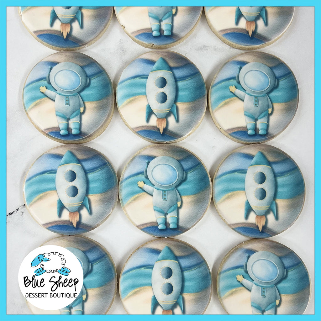 NJ astronaut themed printed sugar cookie party favors, featuring watercolor astronauts and rocketships
