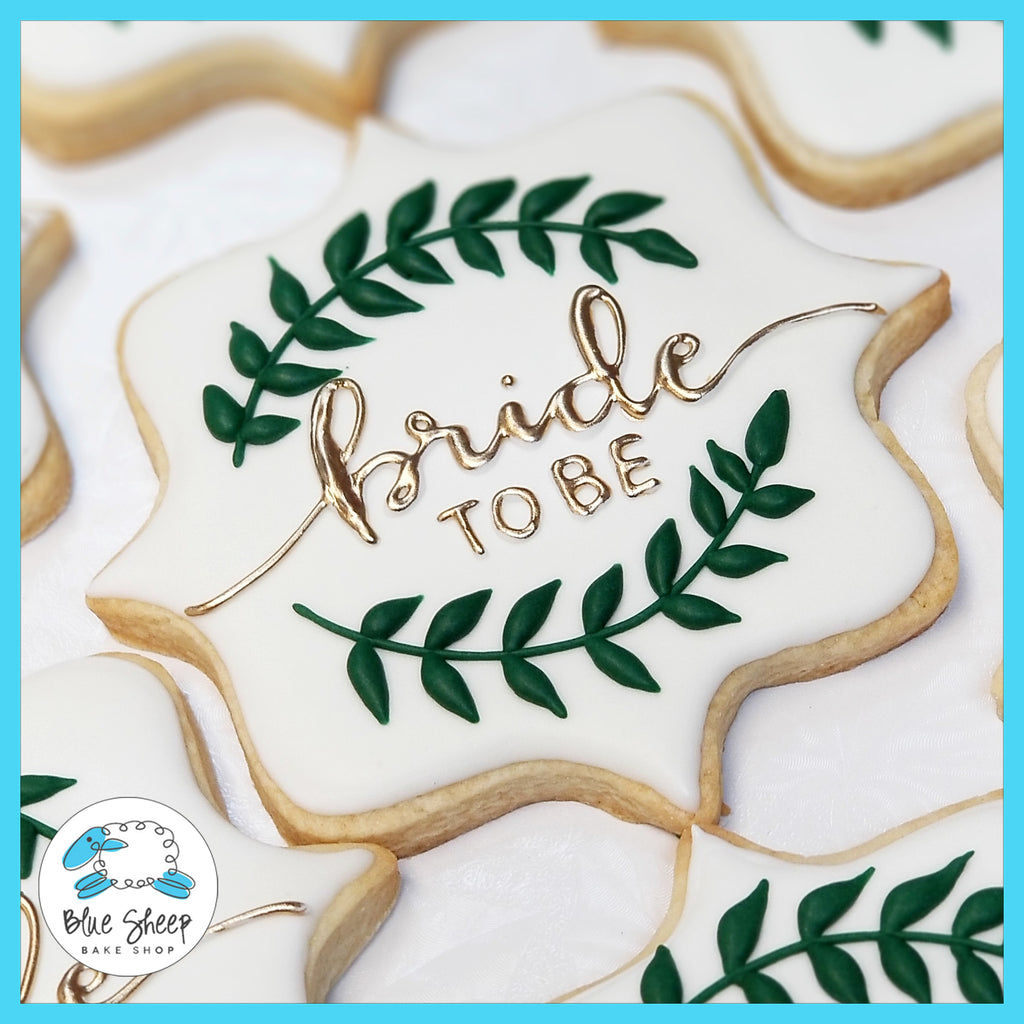 NJ Bride to Be decorated cookie favors with gold painted text and a royal icing wreath